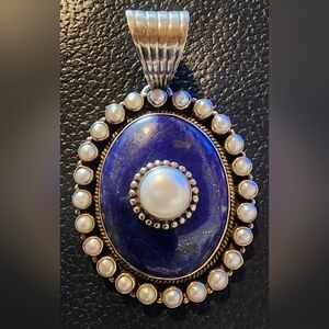 Vintage sterling silver and lapis pendant, Hallmark is "dan dodson"